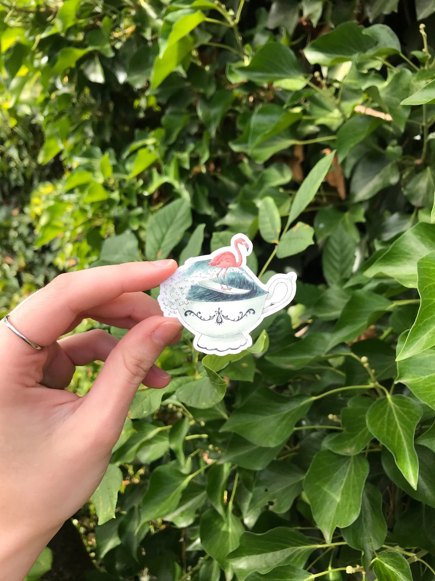 Surfing Flamingo in a Teacup Sticker